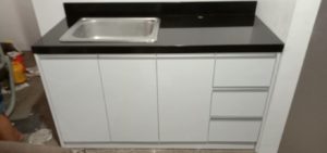 Jet black granite countertop and modular cabinet.